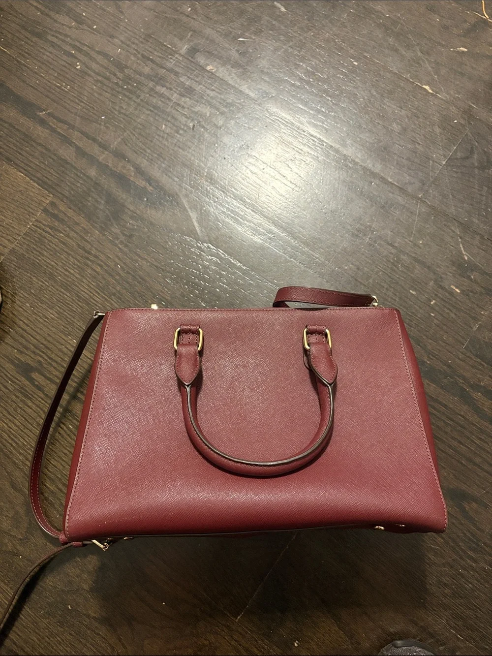 henri bendel wine red saffiano leather satchel with gold-tone charm